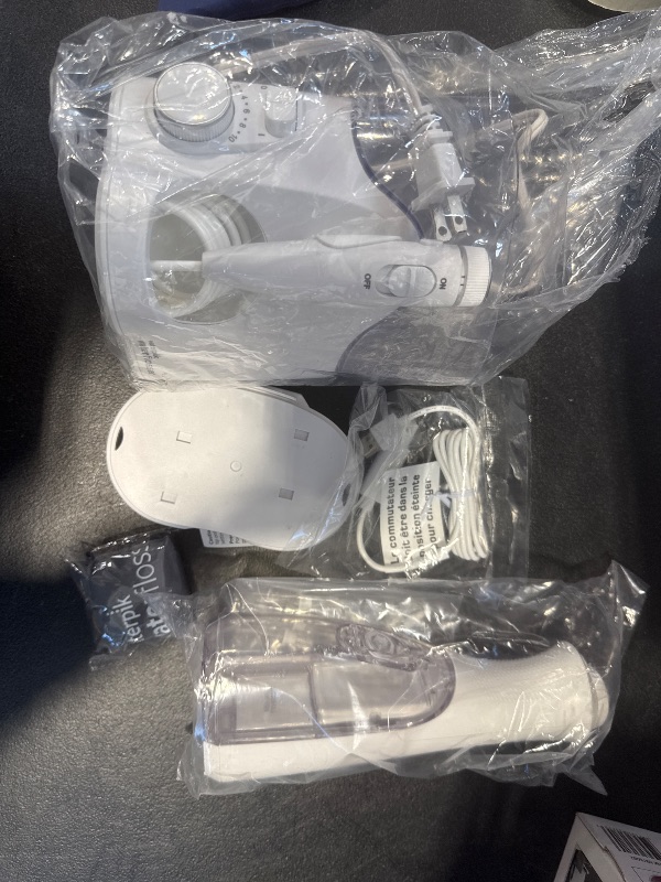 Photo 1 of Waterpik Ultra Plus and Cordless Pearl Water Flosser Combo Pack