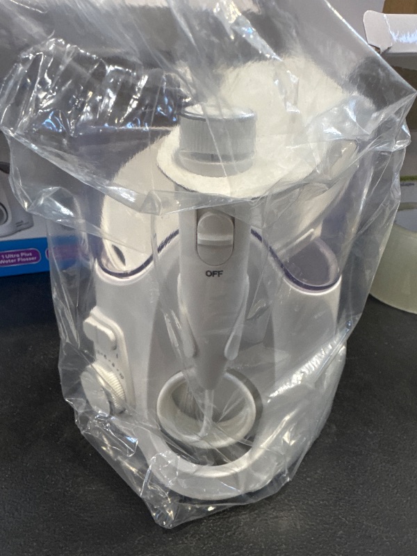 Photo 1 of Waterpik Ultra Plus and Cordless Pearl Water Flosser Combo Pack