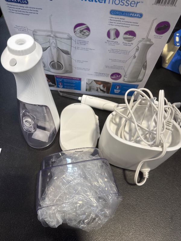Photo 1 of Waterpik Ultra Plus and Cordless Pearl Water Flosser Combo Pack