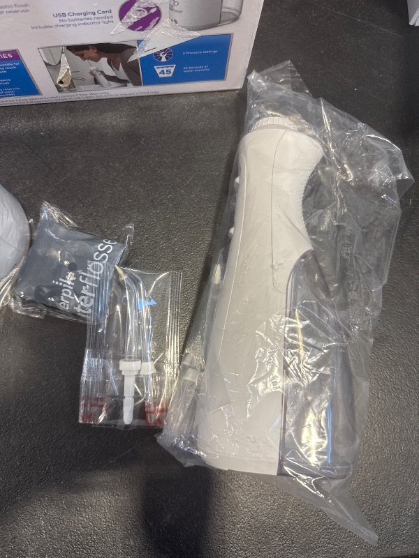 Photo 1 of Waterpik Ultra Plus and Cordless Pearl Water Flosser Combo Pack