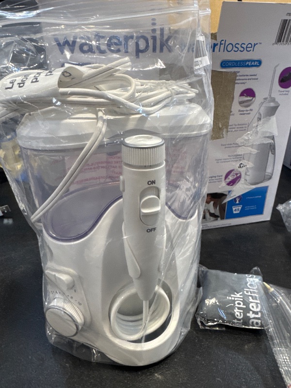 Photo 1 of Waterpik Ultra Plus and Cordless Pearl Water Flosser Combo Pack