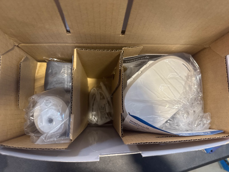 Photo 1 of Waterpik Ultra Plus and Cordless Pearl Water Flosser Combo Pack