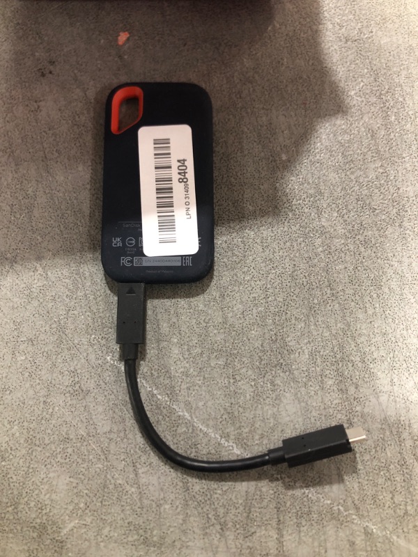 Photo 1 of SanDisk 1TB Extreme Portable SSD - Up to 1050MB/s, USB-C, USB 3.2 Gen 2, IP65 Water and Dust Resistance, Updated Firmware - External Solid State Drive - SDSSDE61-1T00-G25