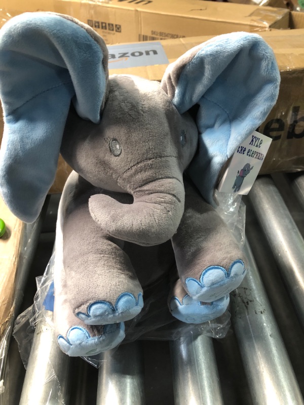 Photo 1 of **APPEARS USED**
Dimple Kyle Peek A Boo Elephant Toy – Interactive Singing Stuffed Elephant Plush with Moving Ears – Musical Stuffed Animal for Kids, Girls, Boys, Toddlers Baby Toy -Easter Basket Stuffers for Toddler