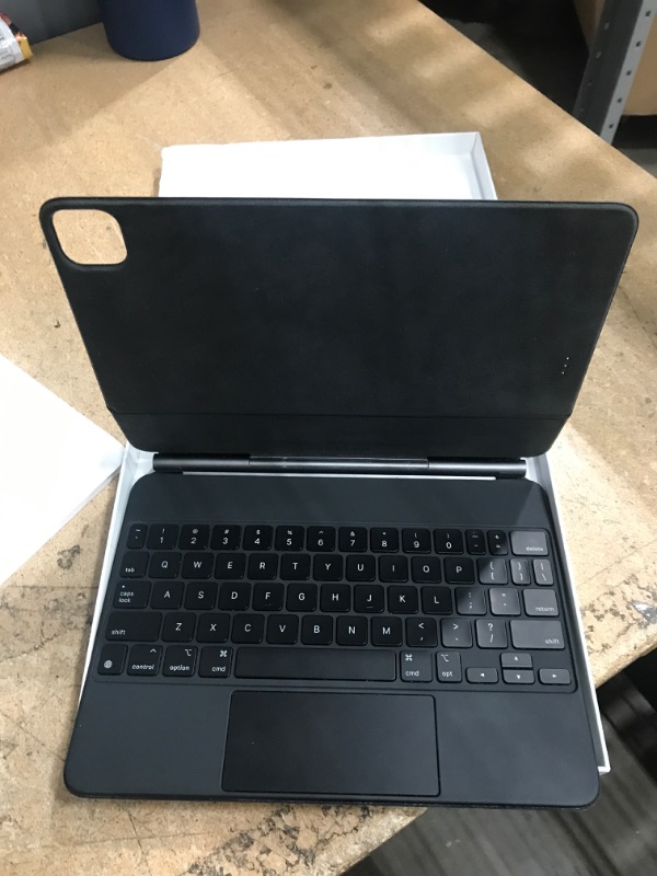 Photo 1 of Apple Magic Keyboard: iPad Keyboard case for iPad Pro 11-inch (1st, 2nd, 3rd, 4th gen) and iPad Air (4th, 5th gen, and M2), Great Typing Experience, Built-in trackpad, US English - Black