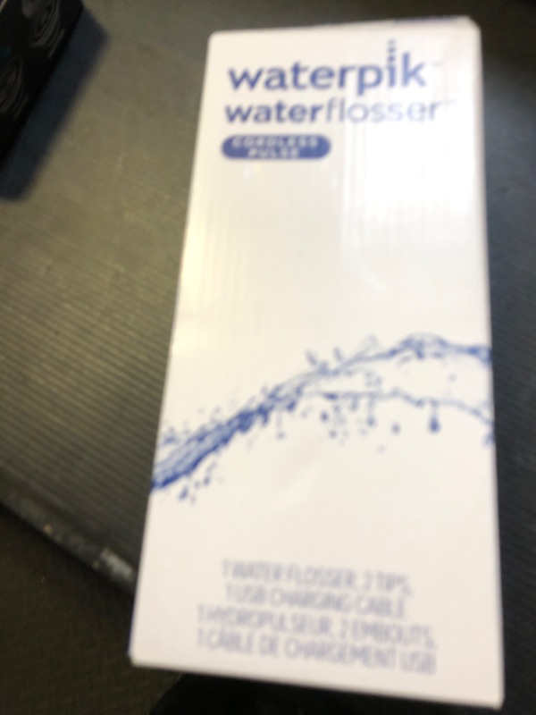 Photo 1 of Waterpik Cordless Pulse Rechargeable Portable Water Flosser for Teeth, Gums, Braces Care and Travel with 2 Flossing Tips, Waterproof, ADA Accepted, WF-20 White, Packaging May Vary