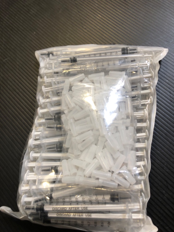 Photo 1 of 100 Pack 1ml Syringe with Cap for Liquid, 1cc Plastic Small Syringes with Cover, Non-Sterile, No Needle