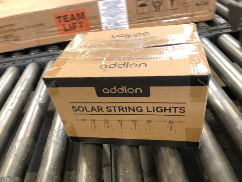 Photo 1 of addlon 54(48+6) FT Solar String Lights Waterproof,Patio Lights Solar Powered with Remote& USB Port 24+2 LED Shatterproof Bulbs 3 Lighting Modes Outdoor Lights for Camping Backyard Garden