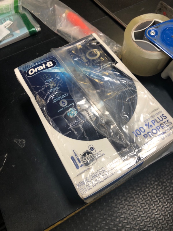 Photo 1 of Oral-B iO Series 5 Rechargeable Electric Toothbrush with Visible Pressure Sensor to Protect Gums, 2 Minute Timer, 5 Cleaning Settings, 1 Replacement Toothbrush Heads, and Travel Case, Black