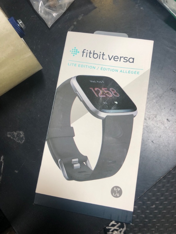 Photo 1 of Fitbit Versa Lite Smartwatch,GPS,Charcoal/Silver Aluminum, One Size (S & L Bands Included)