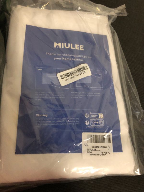 Photo 1 of MIULEE 2 Panels Solid Color White Sheer Window Curtains Elegant Window Voile Panels/Draperies/Treatment for Bedroom Living Room (70 X 96 Inches White)