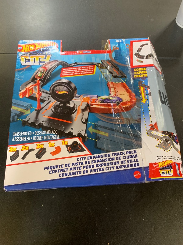 Photo 1 of Hot Wheels Toy Car Track Set Pack, 10 Track-Building Parts with City Square, Bridge & 1:64 Scale Vehicle, Connects to Other Tracks