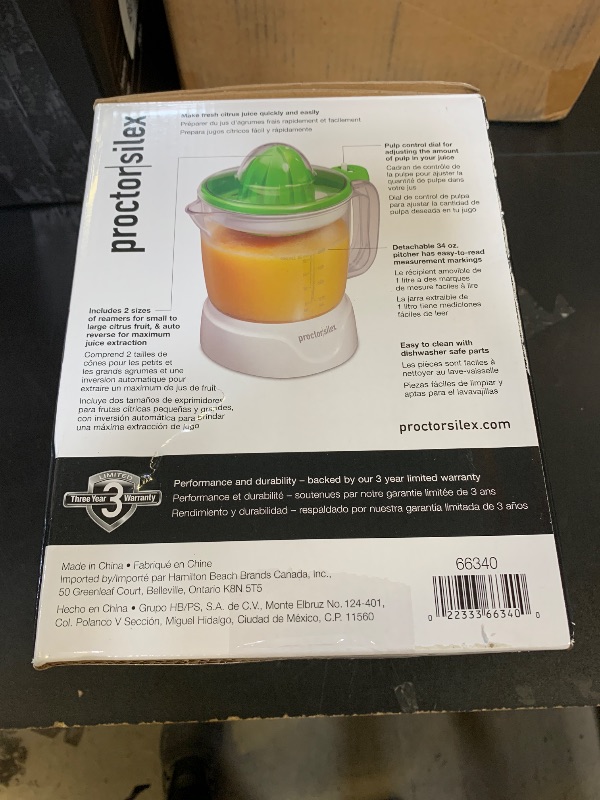 Photo 1 of Proctor Silex Electric Citrus Juicer Machine, Large 34 oz. Pitcher, Pressure Activated, 2 Reamers for Big and Small Fruit, Pulp Control, for Orange, Lemon, Grapefruit Juice, White & Green (66340)