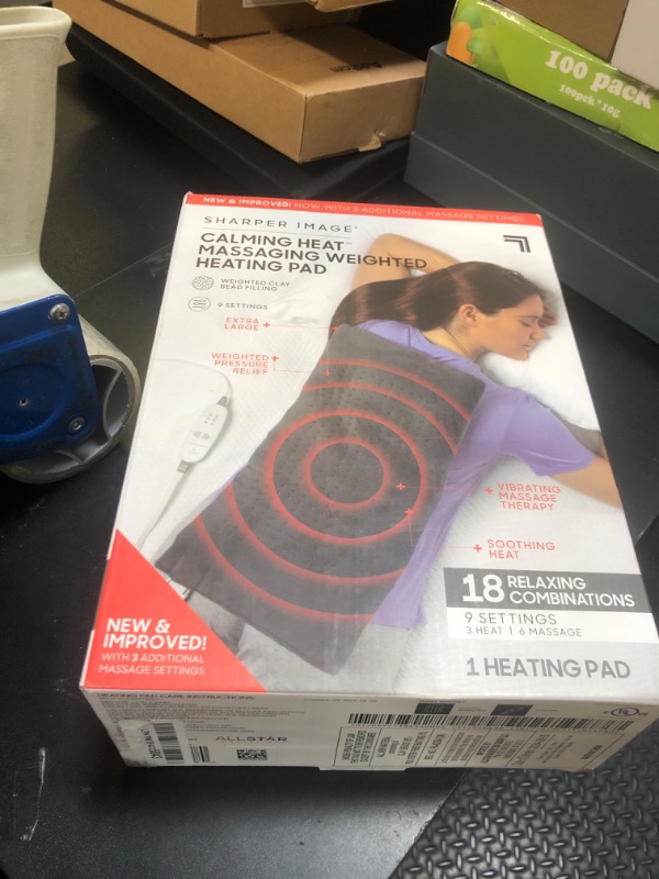 Photo 1 of Calming Heat Massaging Weighted Heating Pad by Sharper Image- Weighted Electric Heating Pad with Massaging Vibrations, 9 Settings- 3 Heat, 6 Massage- 18 Relaxing Combinations, 12” x 24”, 4 lbs
