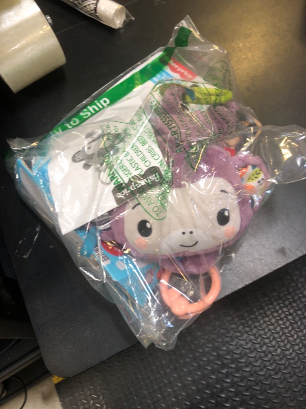 Photo 1 of Fisher-Price Baby Stroller Toy Sing & Go Purple Monkey Musical Sensory Plush with Crinkle & Clackers for Newborns from Birth+