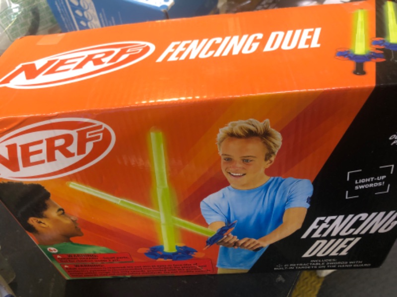 Photo 1 of Nerf Duel Swords Set - Retractable Swords with Glow in the Dark Feature - Integrated Knockdown Targets - Kids Fencing Game, Green, Blue, Orange