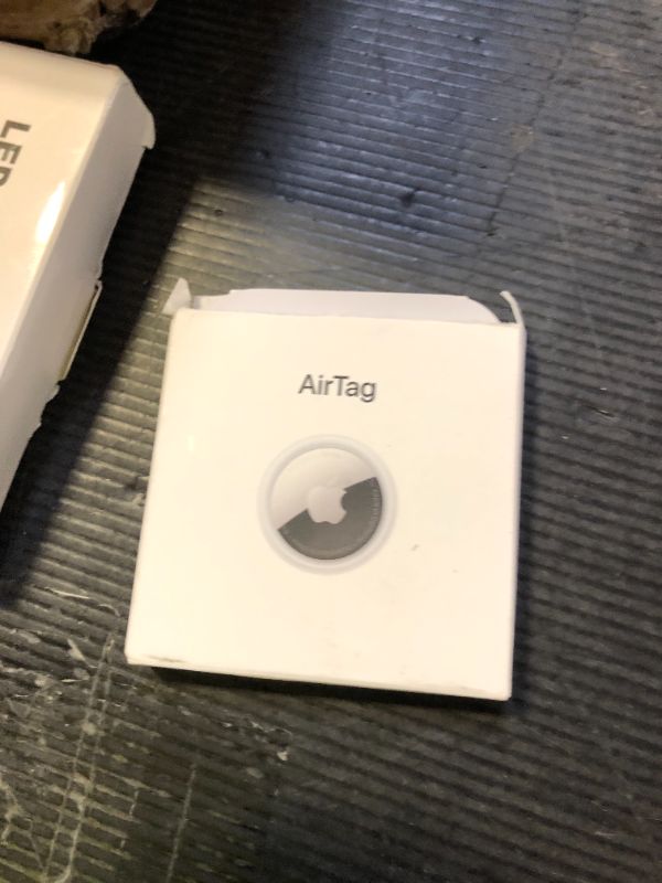Photo 1 of Apple AirTag. Keep Track of and find Your Keys, Wallet, Luggage, Backpack, and More. Simple one-tap Set up with iPhone or iPad