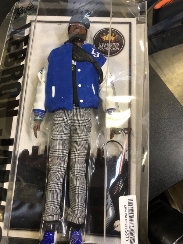 Photo 1 of Barbie Signature Lebron James Kenbassadors Doll Collectible with Varsity Bomber Jacket Outfit & Accessories Including Headphones, Sunglasses, & More (NEW BUT DAMAGED BOX)