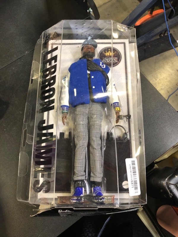 Photo 1 of Barbie Signature Lebron James Kenbassadors Doll Collectible with Varsity Bomber Jacket Outfit & Accessories Including Headphones, Sunglasses, & More (NEW BUT DAMAGED BOX)