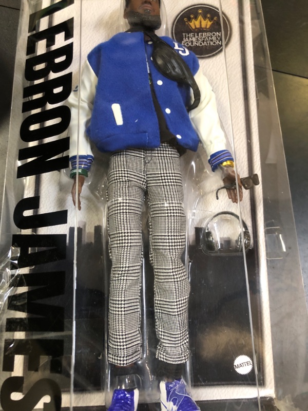 Photo 1 of Barbie Signature Lebron James Kenbassadors Doll Collectible with Varsity Bomber Jacket Outfit & Accessories Including Headphones, Sunglasses, & More