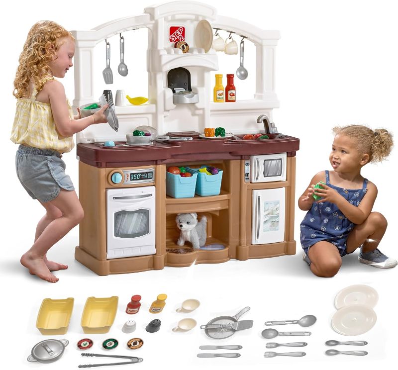 Photo 1 of Step2 Fun with Friends Kids Kitchen Playset, Indoor/Outdoor Kitchenette, Interactive Play with Lights and Sounds, Durable Plastic, Includes 25 Piece Toy Accessories, Toddlers 2+ Years Old, Tan