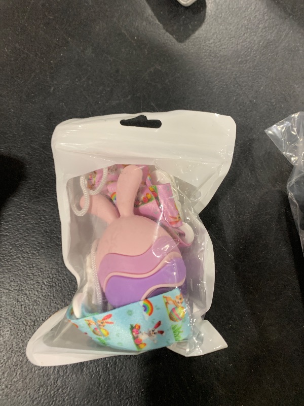 Photo 1 of Easter Egg Bunny Baby Teether for Easter Basket Stuffers, Rabbit Egg Rattle Toy Teething for Easter Basket Essentials Infant Boys & Girls First Gifts with 2 Packs Easter Egg Pacifier Clip, 3 Months+