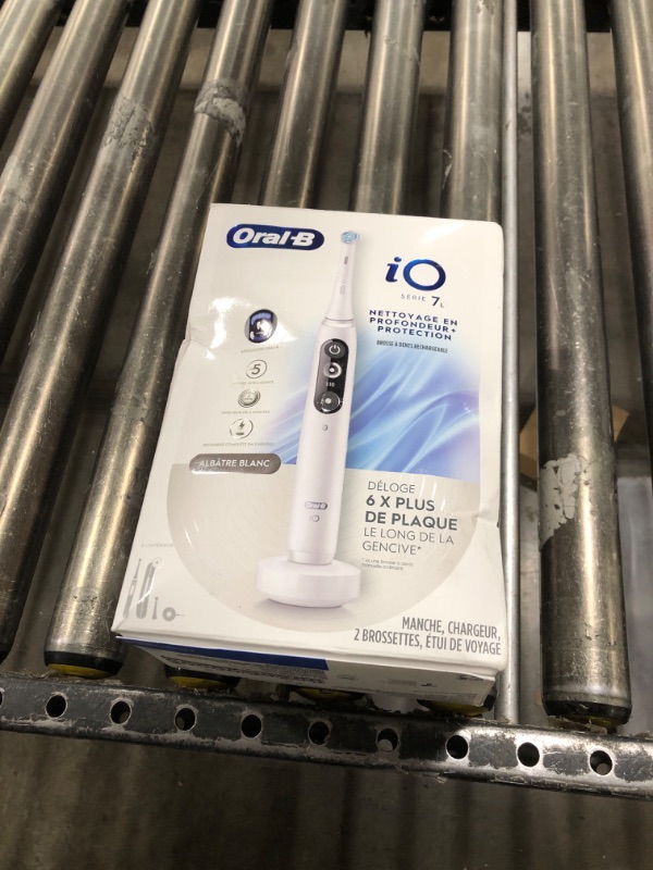 Photo 2 of Oral-B iO Deep Clean + Protect Rechargeable Electric Toothbrush, White with a iO Series 7 Toothbrush