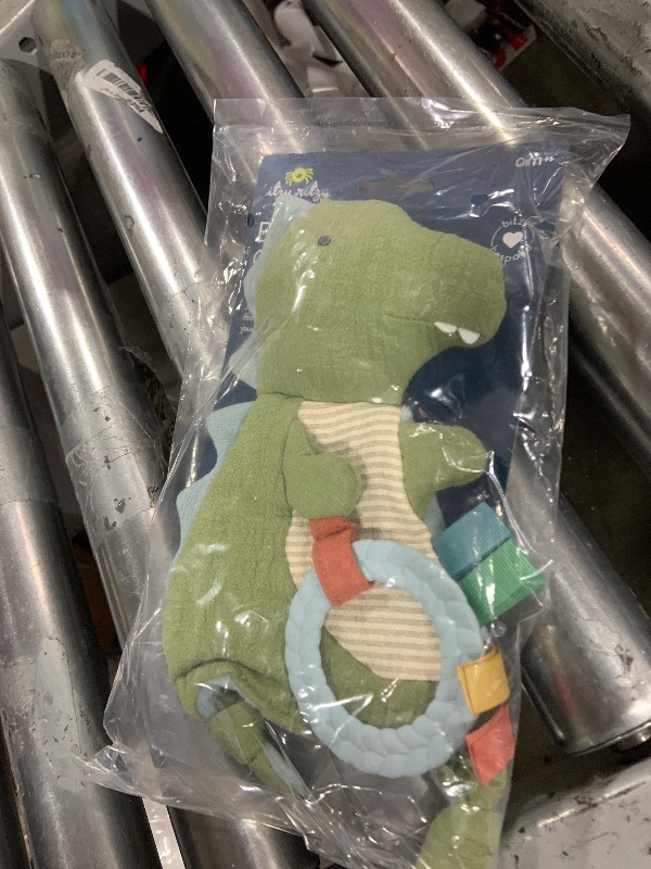 Photo 1 of Itzy Ritzy - Bitzy Crinkle Sensory Toy Dinosaur with Crinkle Sound for Babies & Toddlers - Features Soft Braided Teething Ring & Textured Ribbons, Designed for Ages 0 Months and Up, Dinosaur