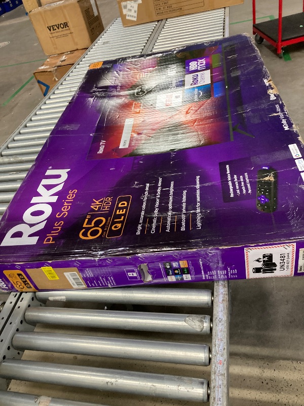Photo 1 of **PARTS ONLY/CRACKED SCREEN**Roku Smart TV – 65-Inch Plus Series 4K QLED RokuTV with Roku Voice Remote Pro, Dolby Vision, Striking 4K Resolution, Automatic Brightness, & Seamless Streaming – Live Local News & Sports