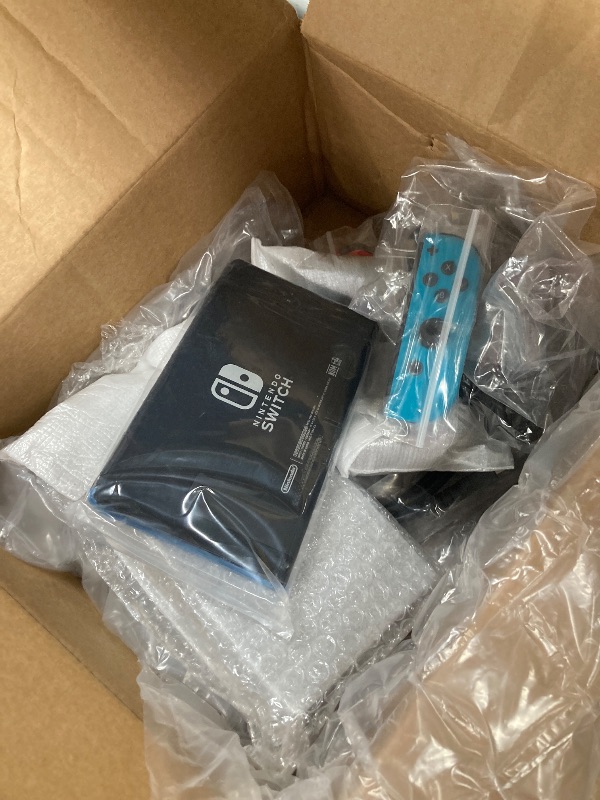 Photo 1 of ***(SELLING AS PARTS ONLY -NON FUNCTIONAL, MISSING PARTS -SELLING AS PARTS ONLY)*** Nintendo Switch with Neon Blue and Neon Red Joy?