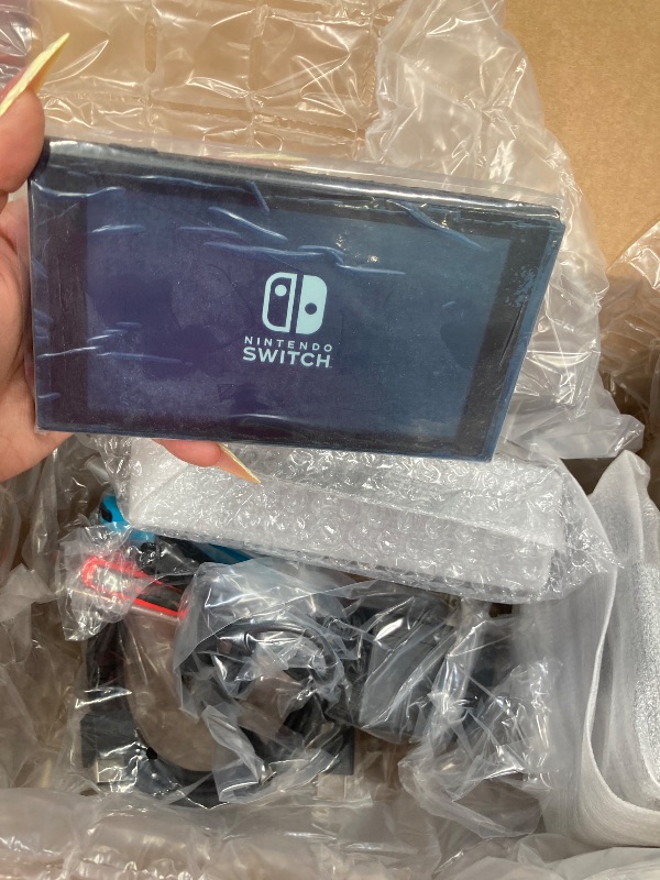 Photo 1 of ***(SELLING AS PARTS ONLY -NON FUNCTIONAL, MISSING PARTS -SELLING AS PARTS ONLY)*** Nintendo Switch with Neon Blue and Neon Red Joy?