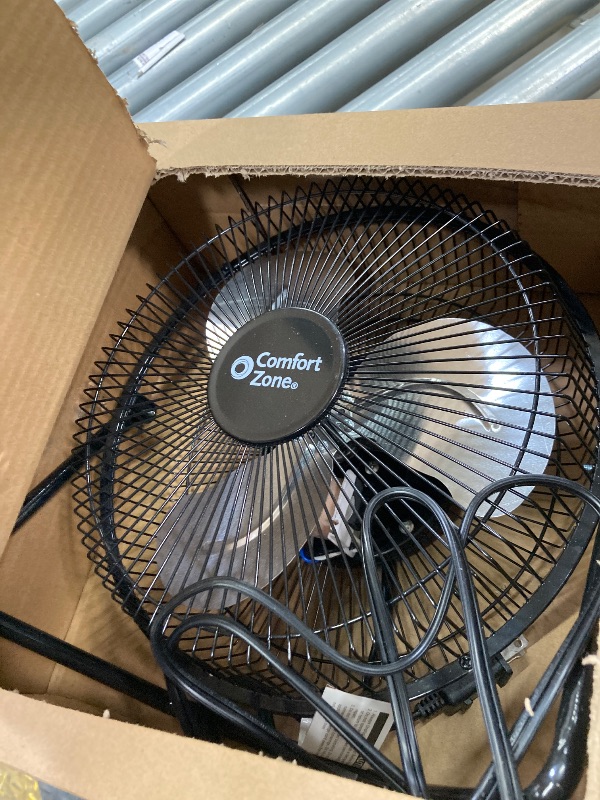 Photo 1 of **BLOWS AIR SLOW/PARTS ONLY**Comfort Zone 9 inch Cradle Fan, 3 Speed Floor or Table Fan with180 Degree Tilt, Metal Construction and Aluminum Blades, Carry Handle, Rubber Feet, Ideal for Bedroom, Workshop, or Garage, Black