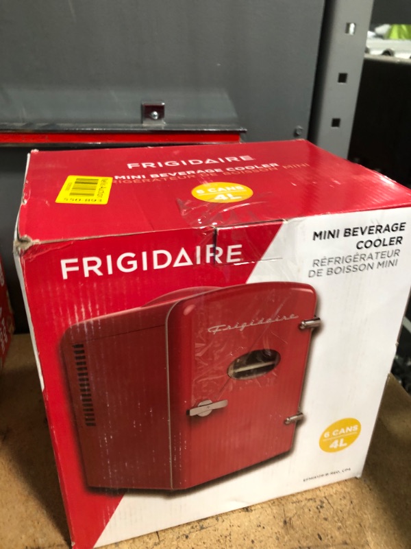 Photo 1 of ***PARTS ONLY***Frigidaire Red Mini Personal Fridge Cooler, 1 Gal Capacity fits Six Cans, Includes Plugs for Home Outlet & DC Charger - 9.9" D x 7.1" W x 10.6" H