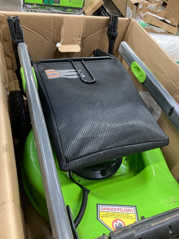 Photo 1 of **SELLING AS PARTS ONLY***DAMAGED HANDLE/MISSING CHARGER***USED GRASS RESIDUE, SOME SCUFFS/SCRATCHES***

Greenworks 40V 17”? Brushless (Push) Cordless Lawn Mower, 4.0Ah Battery and Charger