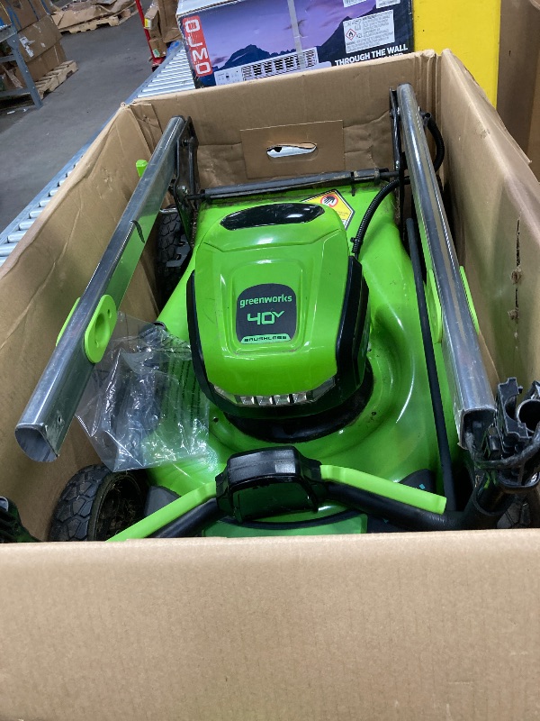 Photo 1 of **SELLING AS PARTS ONLY***DAMAGED HANDLE/MISSING CHARGER***USED GRASS RESIDUE, SOME SCUFFS/SCRATCHES***

Greenworks 40V 17”? Brushless (Push) Cordless Lawn Mower, 4.0Ah Battery and Charger