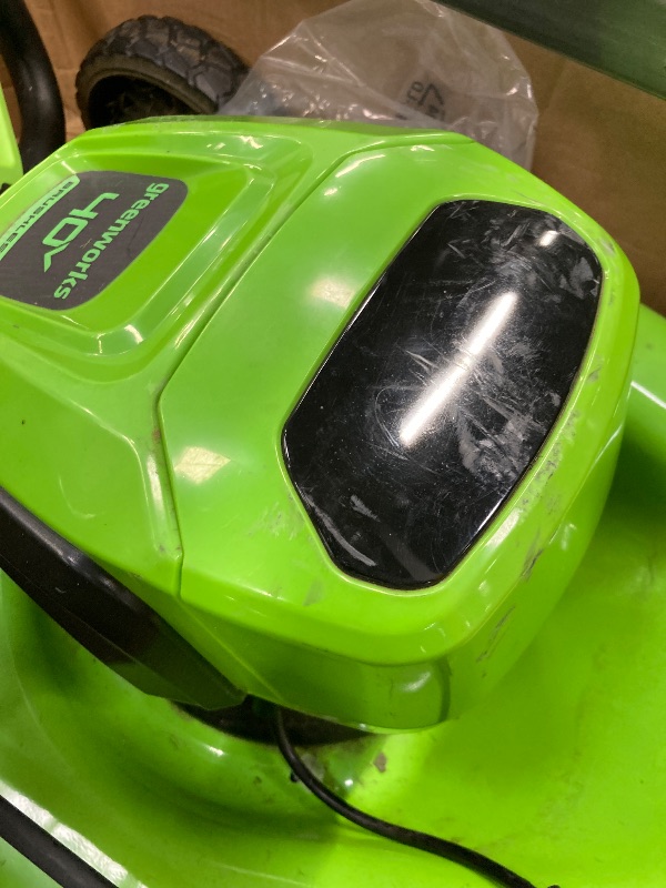 Photo 1 of **SELLING AS PARTS ONLY***DAMAGED HANDLE/MISSING CHARGER***USED GRASS RESIDUE, SOME SCUFFS/SCRATCHES***

Greenworks 40V 17”? Brushless (Push) Cordless Lawn Mower, 4.0Ah Battery and Charger