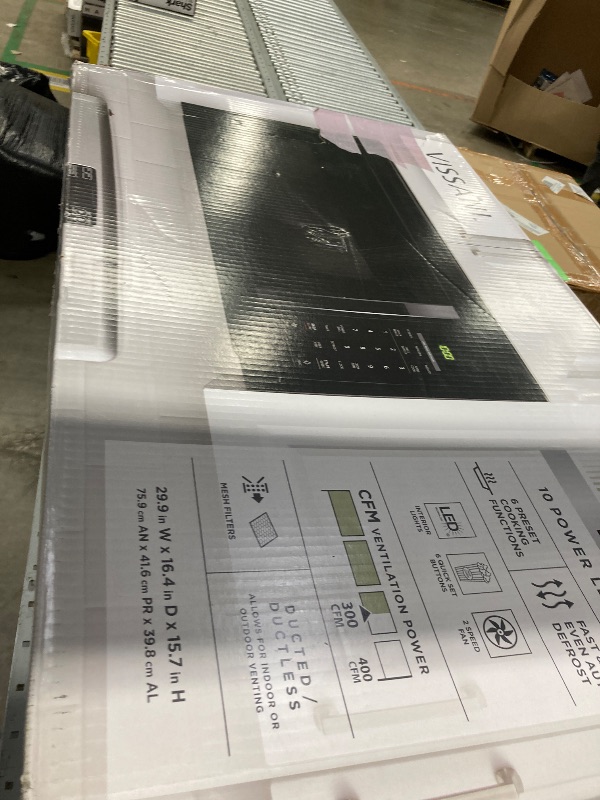 Photo 1 of 1.7 cu. ft. 1000-Watt Over the Range Microwave in Black