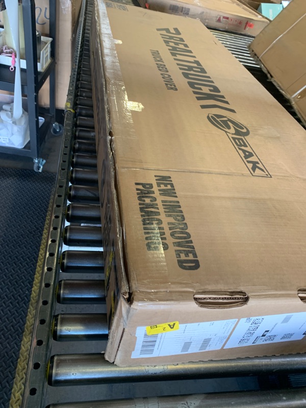 Photo 1 of RealTruck BAK BAKFlip MX4 Hard Folding Truck Bed Tonneau Cover | 448135 | Fits 2019-2025 Chevy/GMC Silverado/Sierra (Works with Carbon Pro Bed) Works w/MultiPro/Flex Tailgate 5' 10" Bed (69.9")