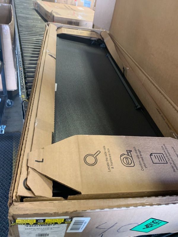 Photo 1 of RealTruck BAK BAKFlip MX4 Hard Folding Truck Bed Tonneau Cover | 448135 | Fits 2019-2025 Chevy/GMC Silverado/Sierra (Works with Carbon Pro Bed) Works w/MultiPro/Flex Tailgate 5' 10" Bed (69.9")