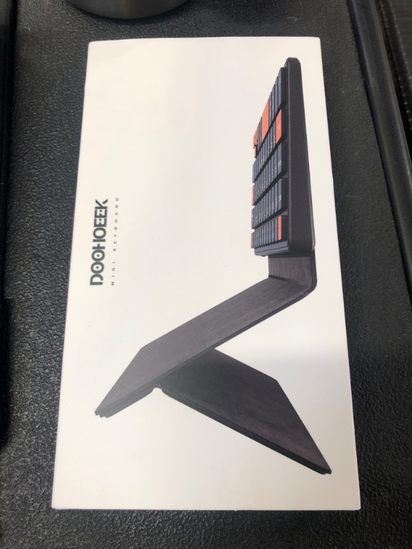 Photo 1 of Doohoeek Universal Bluetooth Mini Keyboard, Wireless Compact Keyboard with Orange Navigation Keys & Any-Angle Stand for Android/iOS/Windows, Dual-Device Keypad for Phones/Galaxy Z Fold/iPad mini