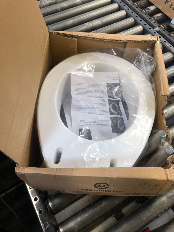 Photo 1 of Carex 3.5 Inch Raised Toilet Seat W/Arms, Round, 250lbs Capacity, White
