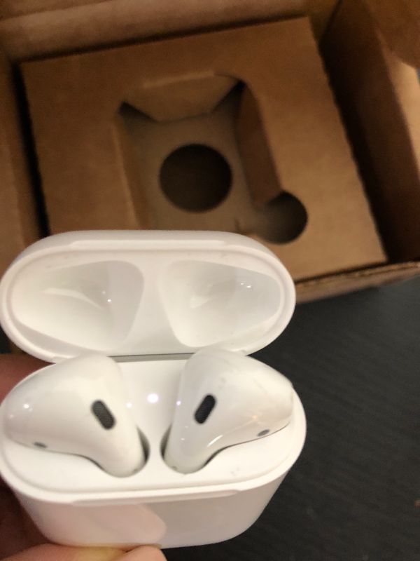 Photo 1 of Apple AirPods Wireless Ear Buds, Bluetooth Headphones with Lightning Charging Case Included, Over 24 Hours of Battery Life, Effortless Setup for iPhone