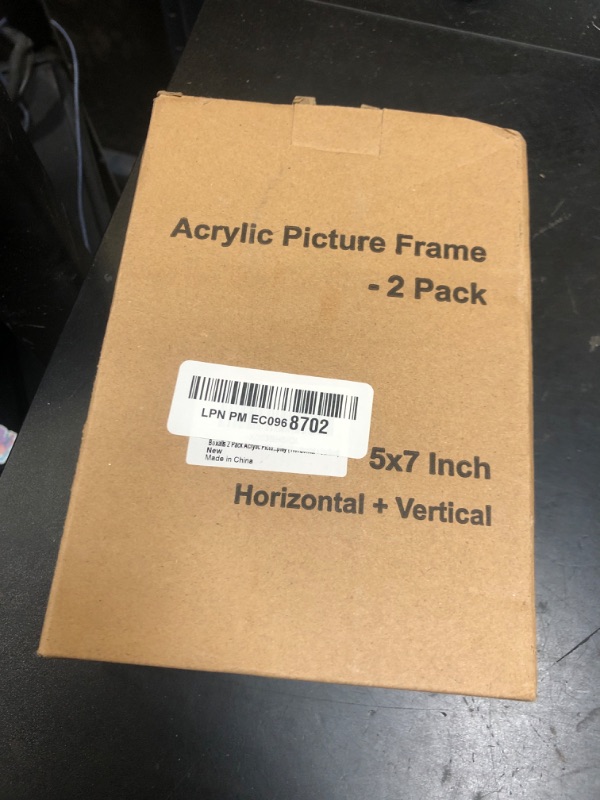 Photo 1 of Boxalls 2 Pack Acrylic Picture Frames 5x7 with Translucent Black Base Stand, Frameless Photo Frame for Tabletop or Desktop Display (Horizontal + Vertical)