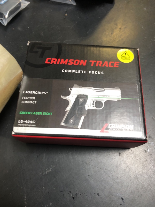 Photo 1 of Crimson Trace LG-404G Lasergrips with Heavy Duty Construction and Instinctive Activation for 1911 Compact Pistols, Defensive Shooting and Competition , Black