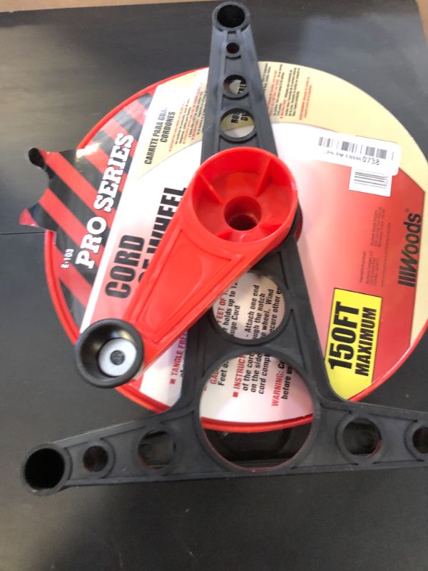 Photo 1 of Woods E103 E-103 Wheel, Holds Up to 150 16/3 Extension 125 Feet of 14/3 Gauge Cord, Holiday, Rope, Hose Reel Storage and Light Wire, Heavy Duty Plastic, red and black