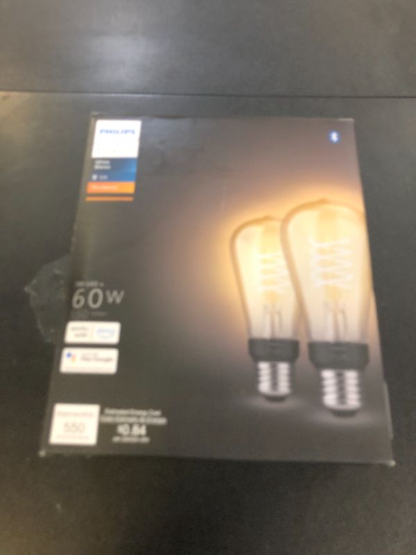 Photo 1 of Philips Hue Smart 60W ST19 Filament LED Bulb - Soft Warm White Light - 2 Pack - 550LM - E26 - Indoor - Control with Hue App - Compatible with Alexa, Google Assistant and Apple Homekit.