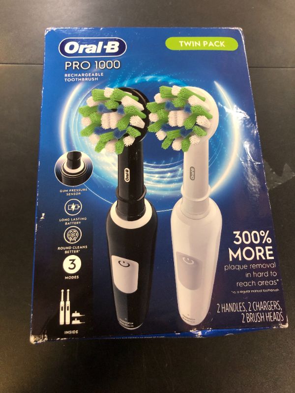 Photo 1 of Oral-B Pro 1000 CrossAction Electric Toothbrush, Black and White, 2 Count