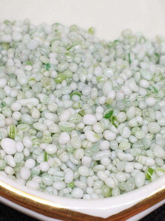Photo 1 of Light green marble pebbles. A bag of 40