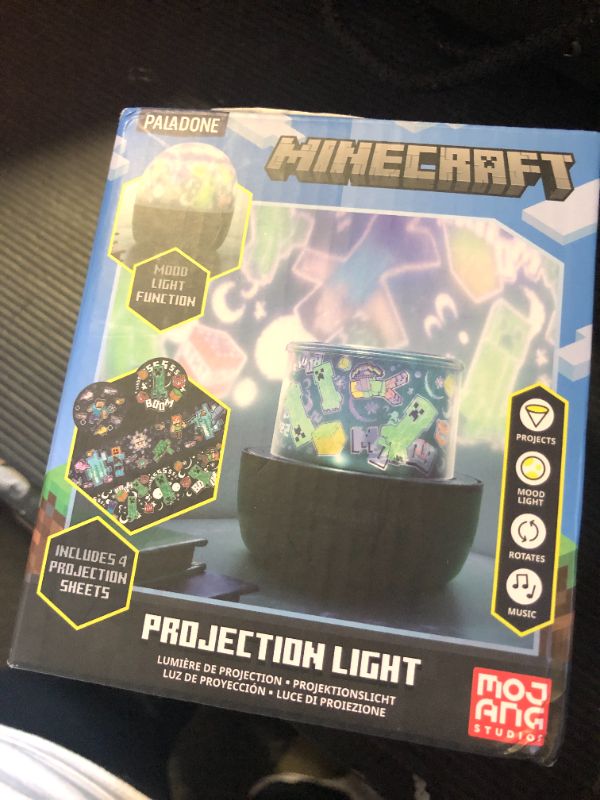 Photo 1 of Paladone Minecraft Officially Licensed Creeper & Steve Projector Night Light, Gamer Projection Lamp Accessory, Minecraft Sounds, Gaming Bedroom Decor for Kids Mood Lighting with 4 Projector Sheets