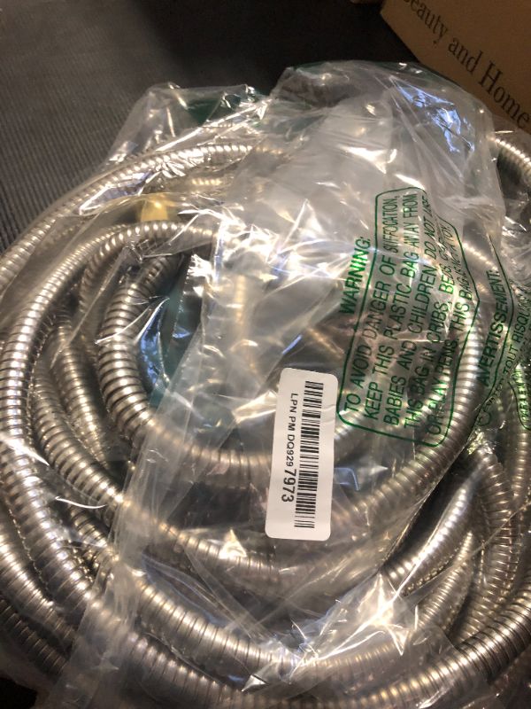 Photo 1 of Numwot 50FT 5/8'' Garden Hose, 304 Stainless Steel Water Hose, Flexible with a 10-Mode Nozzle Sprayer, No Kink, Lightweight, Puncture Proof Metal Hose, Ideal for Yard, Lawn, Outdoor